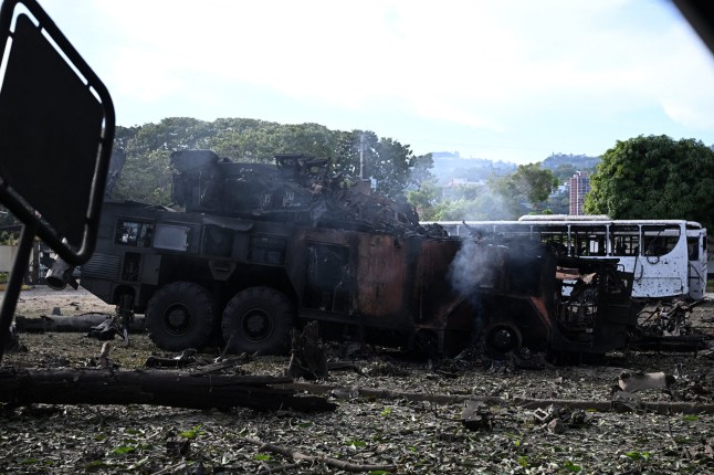 A burnt missile interceptor vehicle is seen at La Carlota air base in Caracas on January 3, 2026, after US forces captured Venezuelan leader Nicolas Maduro after launching a "large scale strike" on the South American country. President Donald Trump said on January 3, 2025, that US forces had captured Venezuela's leader Nicolas Maduro after bombing the capital Caracas and other cities in a dramatic climax to a months-long standoff between Trump and his Venezuelan arch-foe. (Photo by Federico PARRA / AFP via Getty Images)