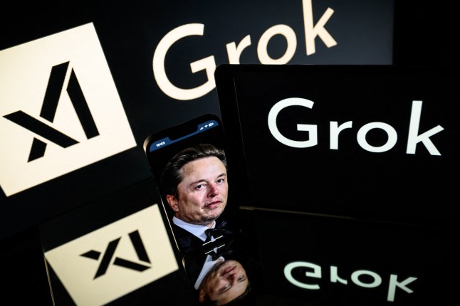 (FILES) This photograph taken on January 13, 2025 in Toulouse shows screens displaying the logo of Grok, a generative artificial intelligence chatbot developed by xAI, the American company specializing in artificial intelligence and it's founder Elon Musk. Indonesia suspended Elon Musk's AI chatbot Grok on January 10, 2026 over concerns about AI-generated pornographic content, the country's communication and digital minister said. (Photo by Lionel BONAVENTURE / AFP via Getty Images)