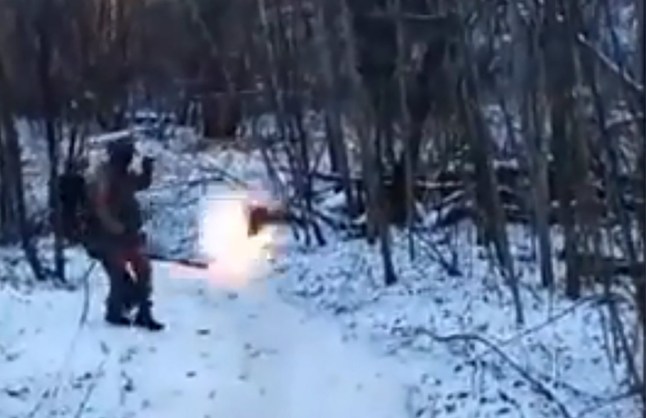 A North Korean soldier fighting for Putin in Ukraine is seen enjoying a ride in the snow until his sledge explodes a mine.